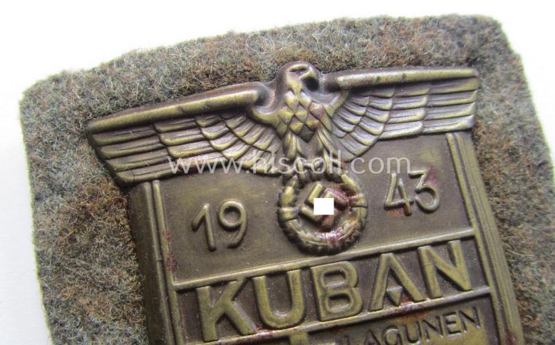 Attractive - truly worn and actually scarcely encountered! - WH (Heeres ie. Waffen-SS) 'Kuban'-campaign-shield that comes mounted onto its original field-grey-coloured- and/or woolen-based 'backing' as issued and/or used