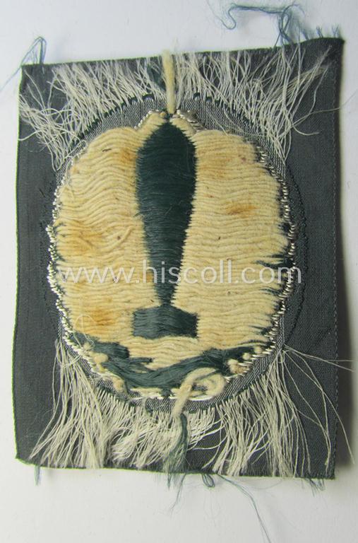 Superb - and extremely rarely encountered! - 'BeVo'-woven version of a WH (Heeres) so-called: trade- and/or special-career insignia, as was intended for a: 'Nebelwerfer Richtkannonier' (or: qualified smoke-troops canon-operator)
