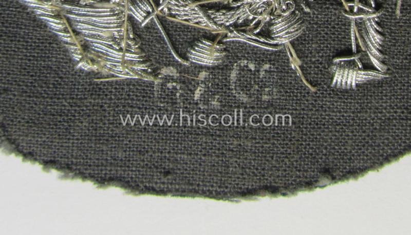 Superb, WH (Heeres) trade- and/or special-career insignia being a detailed- and/or neatly hand-embroidered example as executed on darker-green-coloured wool as was intended for a: 'Steuermann' (ie. enigineer-boat-pilot or helmsman)