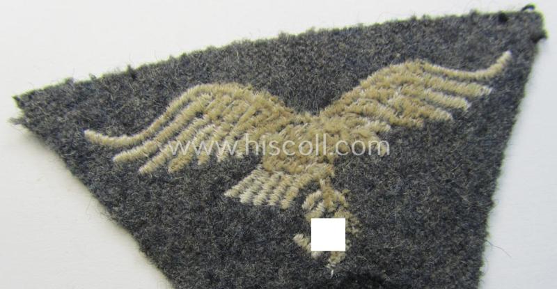 Attractive - and scarcely encountered! - WH (Luftwaffe) so-called: 'M43-pattern'-cap-trapezoid (being a machine-embroidered and carefully cap-removed example that is executed on a bluish-grey-coloured- and/or woolen-based background)