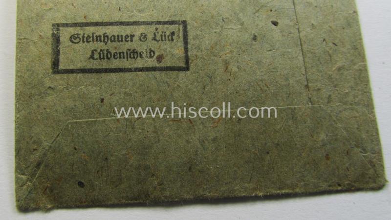Attractive, silver-class wound-badge (or: 'Verwundeten-Abzeichen in Siber') being a non-maker-marked example that comes stored in its original, carton-based pouch as was produced by the maker (ie. 'Hersteller'): 'Steinhauer & Lück'