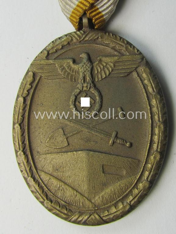 Interesting medal-set: 'Deutsches Schutzwall Ehrenzeichen' (aka: 'Westwall'-medal) being a non-maker-marked- (and/or: typical 'Buntmetall'-based) specimen that came mounted onto its (scarcely seen!) Austrian-styled and trapezoid-folded ribbon