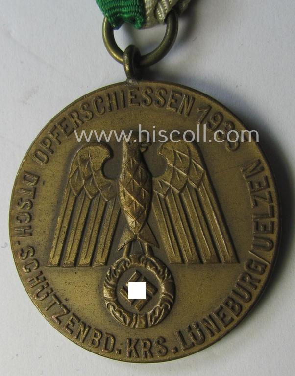 Superb - and most certainly unusually seen! - bright-golden-toned, TR-period shooting-medal that is entitled: 'Opferschiessen 1935 - Dtsch. Schützenbd. Krs. Lüneburg/Uelzen' that comes mounted onto its nicely preserved ribbon as issued