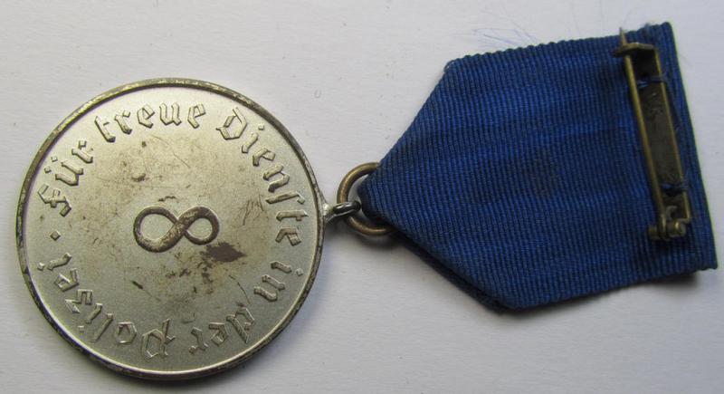 Attractive, bright-silver-toned, so-called: 'Polizei-Dienstauszeichnung 3. Stufe' (or: police loyal-service medal third-class) that comes mounted onto its period ribbon (ie. 'Bandabschnitt')