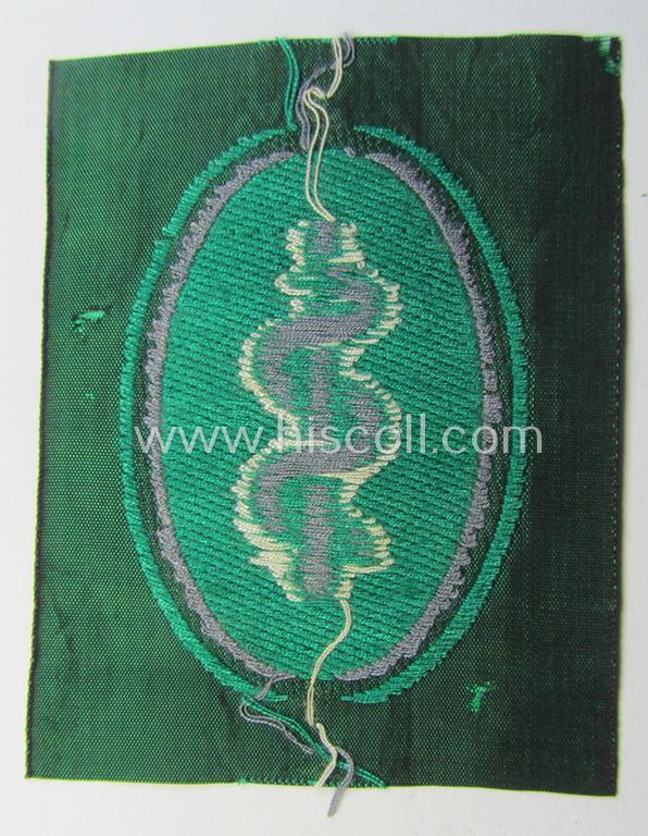 Attractive, 'Sicherheits- u. Hilfsdienst' (ie. 'SHD'-) armbadge (ie. 'Ärmelabzeichen') being a greyish-coloured example depicting an: 'Aesculapus'-symbol as was intended for a member serving as a: 'Feldscher'