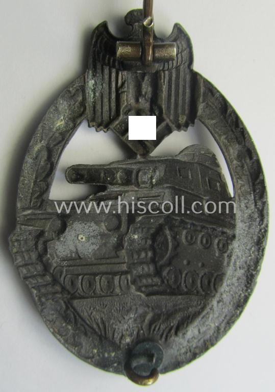 'Panzerkampf-Abzeichen in Bronze' being a 'hollow-back', non-maker-marked- (and/or: zinc- ie. 'Feinzink'-) based example as was procuced by the: 'C.E. Juncker'-company