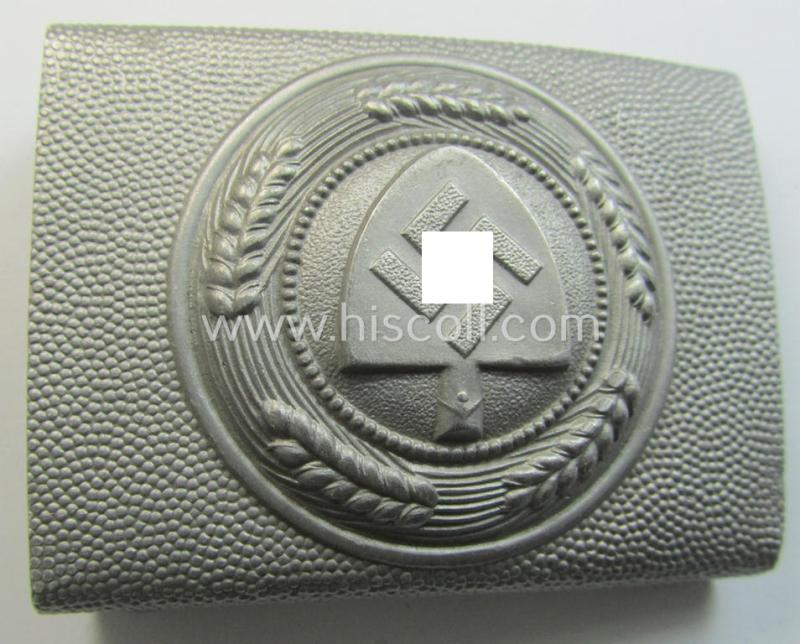 Superb, aluminium-based: 'Reichsarbeitsdienst'- (ie. RAD-) EM- (ie. NCO-) type belt-buckle being a maker- (ie. 'F.W. Assmann u. Söhne'-) marked example which is dated: '1938' and that comes in a simply never used- (ie. 'virtually mint'-) cond...