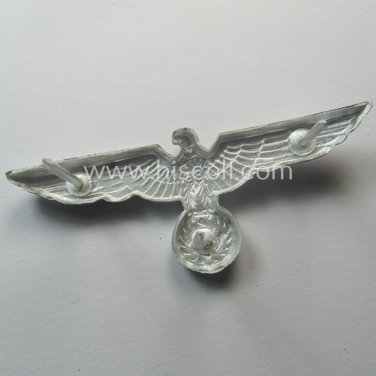 Superb, WH (Heeres) bright-silver-toned (ie. aluminium-based), EM- (ie. NCO- or officers') type visor-cap-eagle being a clearly maker- (ie. 'F.L.L.'-) marked and/or '38'-dated example that comes in a 'virtually mint- ie. unissued'-, condition