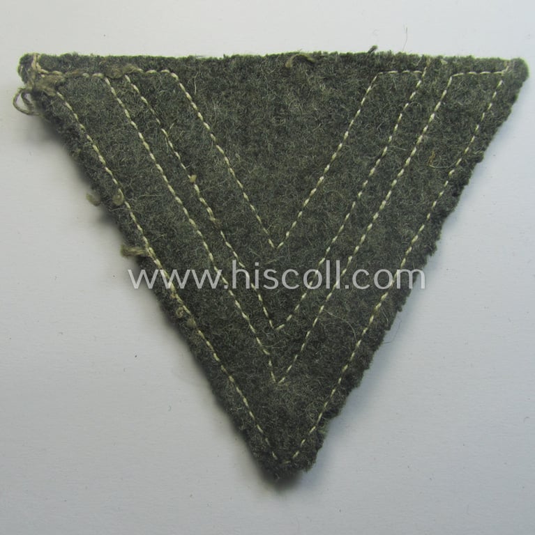 WH (Heeres) 'Armwinkel' (or: arm-chevron) as executed on typical field-grey-coloured wool as was specifically intended for usage by a soldier with the rank of: 'Obergefreiter'