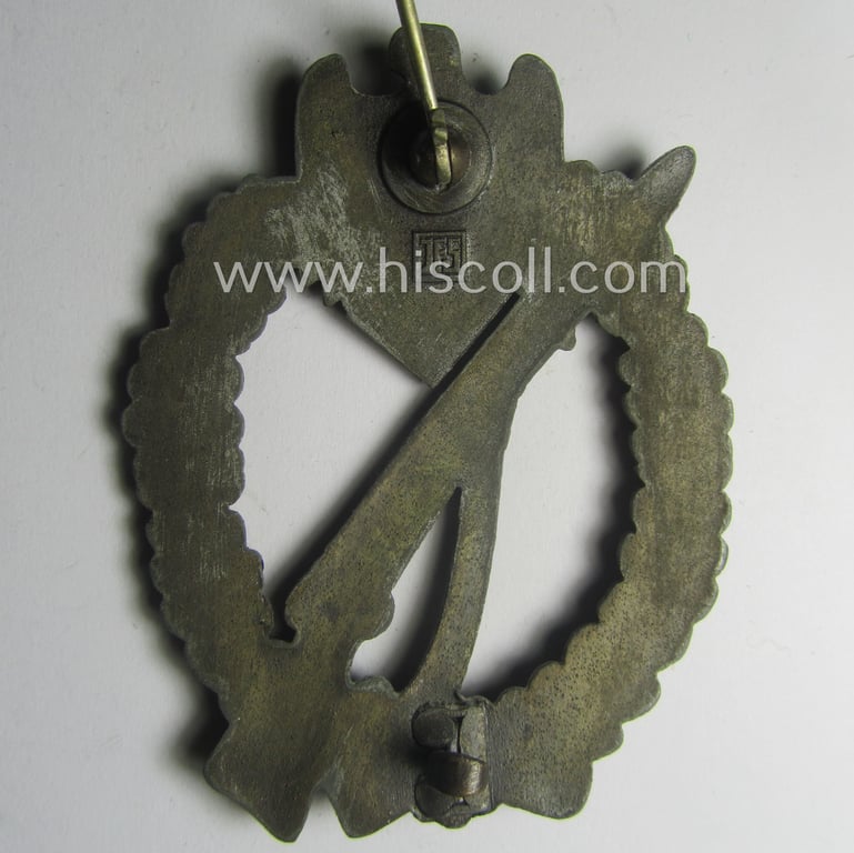 'Infanterie Sturmabzeichen in Bronze' being a maker- (ie. 'JFS'-) marked, 'solid-back' example by the desirable maker: 'Josef Feix u. Söhne' as was executed in golden-bronze-coloured, zinc-based metal