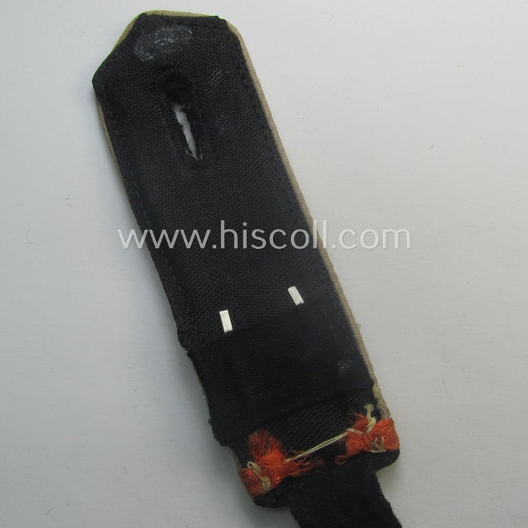 Single - and scarcely found! - white-piped, so-called: 'Reiter-HJ' (ie. 'HJ-Streifendienst') shoulderstrap as was intended for usage by a: 'HJ-Oberscharführer' as attached to the: 'Bann 284' (= 'Bann Uelzen-Daunenberg' in the 'Gebiet Nord Nordsee')