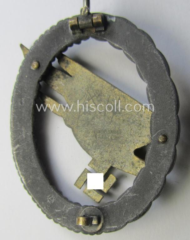 Zinc- (ie. 'Feinzink'-) based version of a WH (Luftwaffe) 'Fallschirmschützen-Abzeichen' (being a maker-marked, 'Type A'-pattern example as was produced by the 'G.H. Osang'-company)