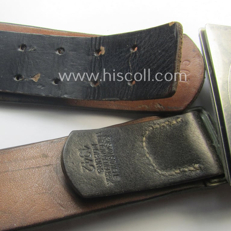 Moderately used, early- (ie. mid-) war-period, black-coloured WH (Heeres, Luftwaffe, Waffen-SS etc.) 'standard-issue'-pattern belt (ie. 'Koppelriemen') being a 105 cms. sized example that shows a (clear) makers'-designation and/or date: '1942'