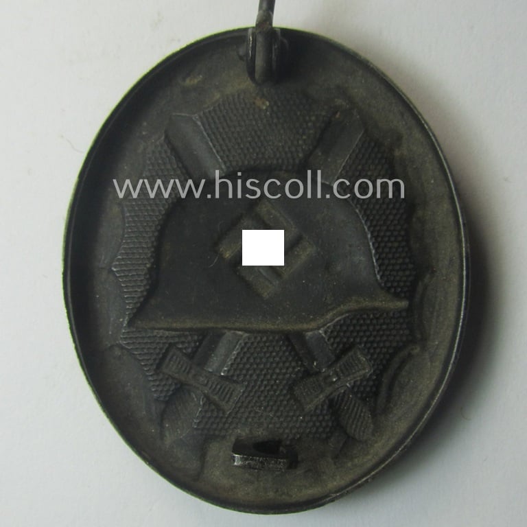 Truly worn - and neatly maker- (ie. '16'-) marked! - example of a black-class wound-badge (or: 'Verwundeten-Abzeichen in Schwarz') as was produced by the (unusually seen!) maker (ie. 'Hersteller'): 'Alois Rettenmaier'
