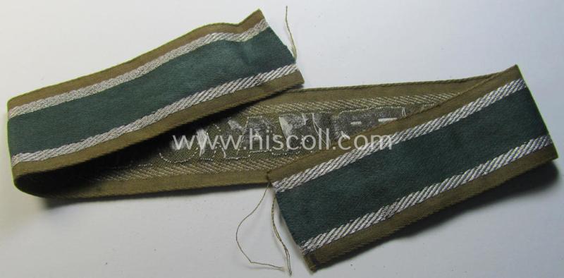 Attractive, 'BeVo'-like cuff-title (ie. 'Ärmelstreifen') entitled: 'Afrikakorps' being a with certainty issued and truly worn example that comes in an overall nice- (ie. minimally shortened- and/or once tunic-attached-), condition