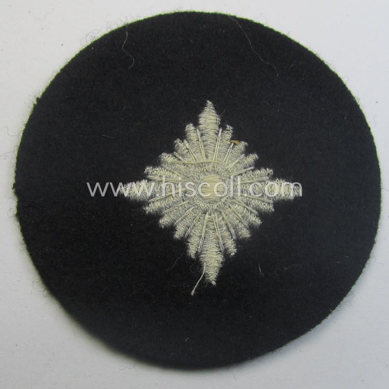 Waffen-SS- (ie. Heeres-'Panzer'-) type, machine-embroidered rank-badge (or: roundel) as was executed on smooth-type- and black-coloured wool as was intended for an: 'SS-Oberschütze' (ie. Heeres 'Oberschütze')