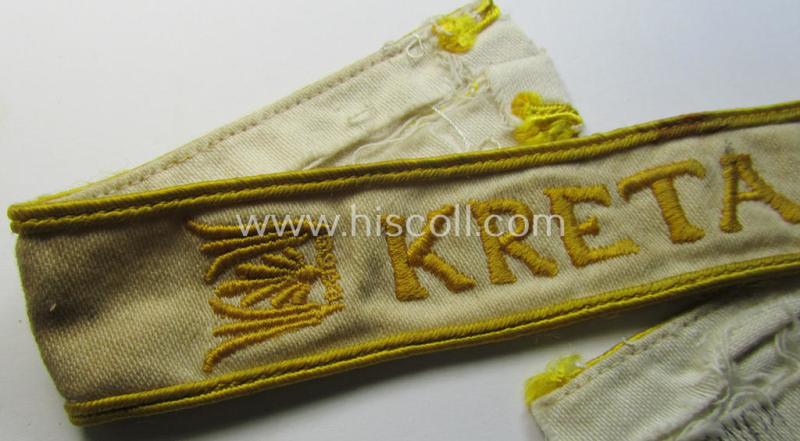 Superb, WH cuff-title (ie. 'Ärmelstreifen') entitled: 'Kreta' (being an example that bears a printed 'RbN.'-numeral and that comes in an issued-, clearly worn- and/or most certainly once tunic-attached, condition)
