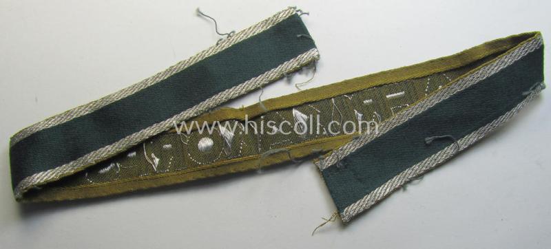 Attractive, 'BeVo'-like cuff-title (ie. 'Ärmelstreifen') entitled: 'Afrikakorps' being a with certainty issued and truly worn example that comes in an overall nice- (ie. hardly shortened- and/or once tunic-attached-), condition