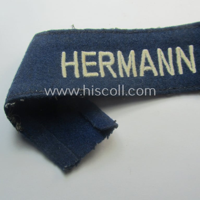 Truly used and typical 'smooth-woolen'-based, EM- (ie. NCO-) pattern WH (Luftwaffe) cuff-title (ie. 'Ärmelstreifen') entitled: 'Hermann Göring' that comes in a period-shortened and worn condition