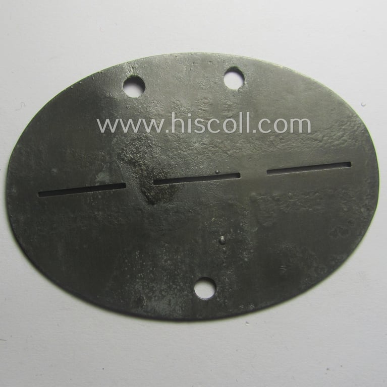 Zinc-based, WH (Heeres) 'Grenadiere'-related ID-disc bearing the clearly stamped unit-designation that reads: 'Stammkp.Gren.E.A.B.mot. 119' and that comes as issued and/or worn