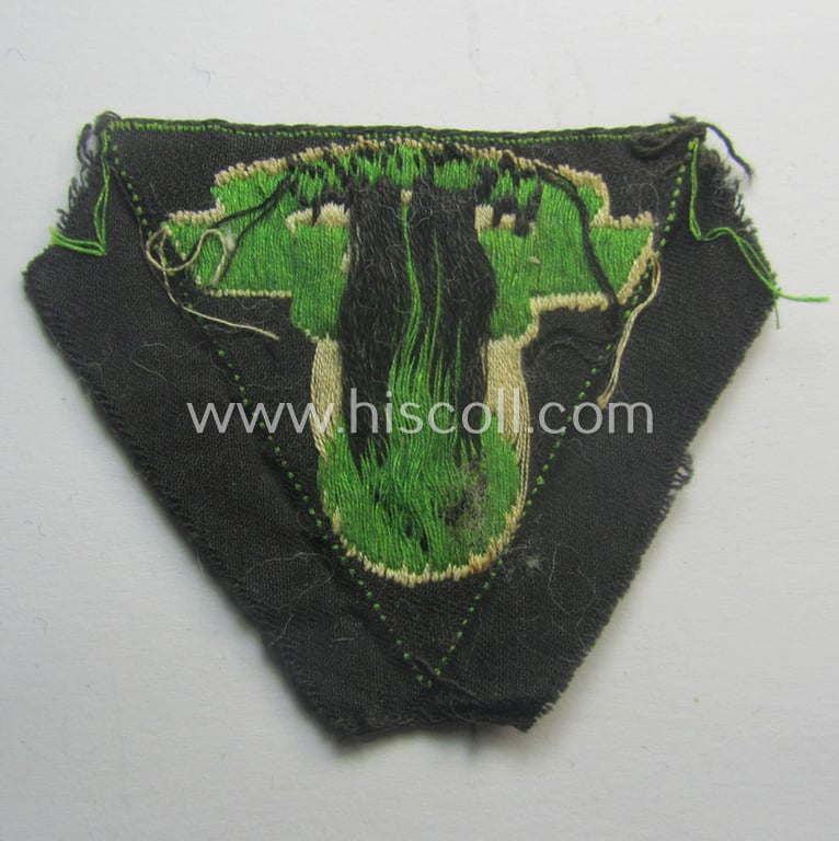 N.S.K.K. (ie. 'National Socialistisches Kraftfahr Korps') side-cap-eagle (ie. 'Adler für N.S.K.K.-Schiffchen o. Lagermütze') being a 'BeVo'-woven-example onto a bright-green-coloured background