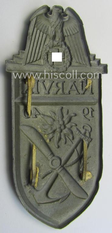 'Virtually mint' - albeit regrettably incomplete - example of a WH (Kriegsmarine) 'Narvik'-campaign-shield as executed in typical: 'Feinzink' (as was presumably produced by the: 'Wilhelm Deumer'-company)