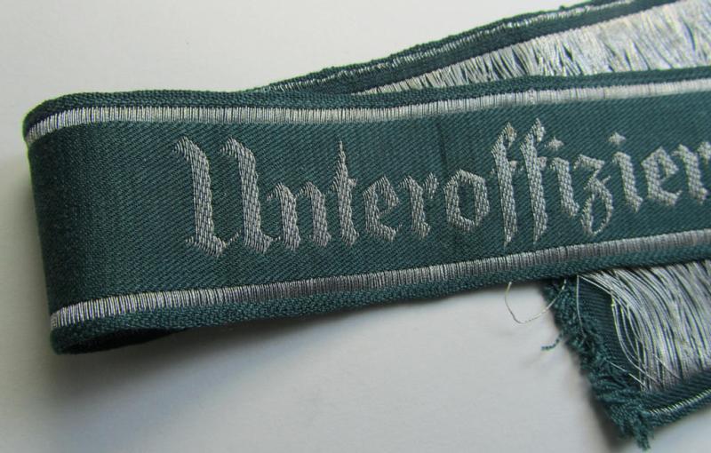 Superb example of an - actually scarcely encountered! - WH (Heeres) linnen-based cuff-title (ie. 'Ärmelstreifen') entitled: 'Unteroffiziervorschule' (as was executed in so-called: 'flat-wire'-style- ie. 'BeVo-weave'-pattern)