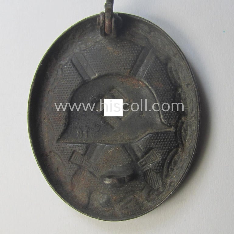 Neatly maker- (ie. '81'-) marked example of a black-class wound-badge (or: 'Verwundeten-Abzeichen in Schwarz') being an example that was produced by the maker (ie. 'Hersteller') named: 'Overhoff & Cie.'