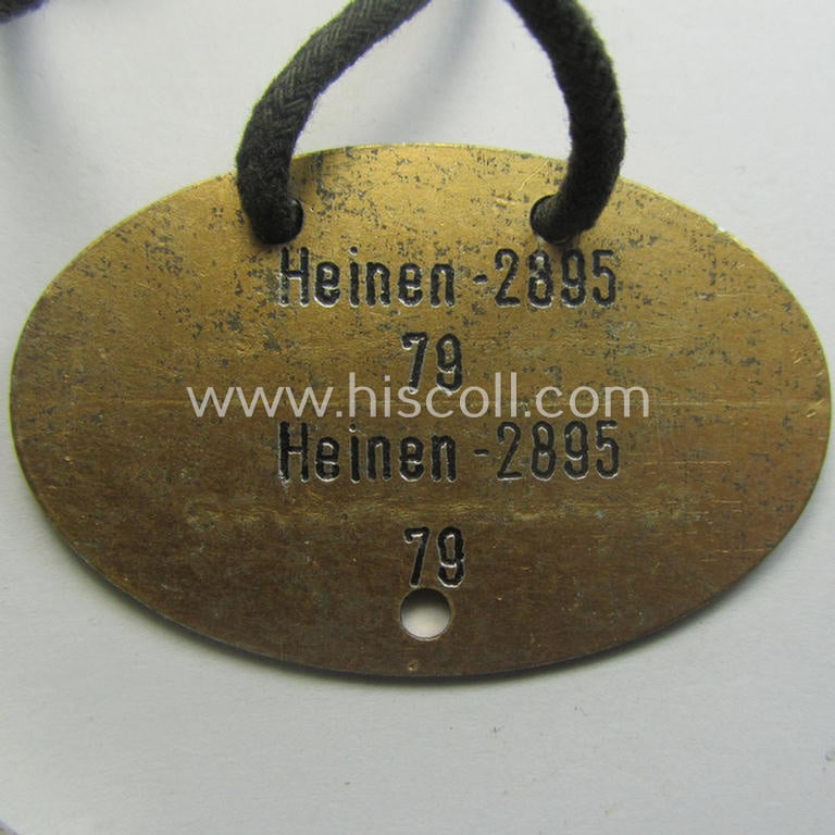 'Standard-issue'-pattern, WH (KM) typical aluminium-based- and/or bright golden-toned ID-disc (ie. 'Erkennungsmarke'): 'K.M.W. Ress. I - Wihelmshaven -  Heinen - 2895 - 79' and accompanying 'Bootsmanns-Flöte'