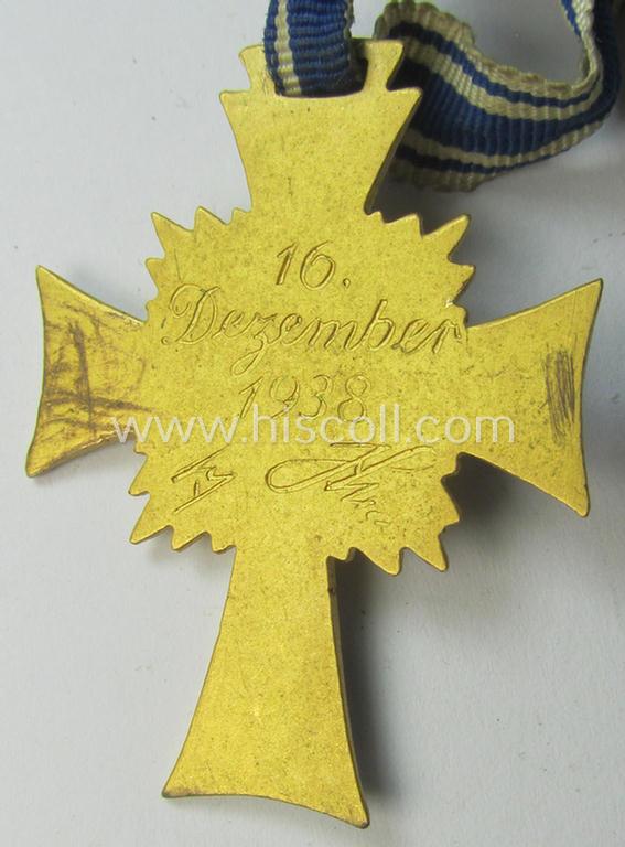 Attractive, 'Ehrenkreuz der deutschen Mutter - erste Stufe' (or: golden-class mothers'-cross) being a hardly used example that comes mounted onto its accompanying, long-sized ribbon as issued and/or recently found