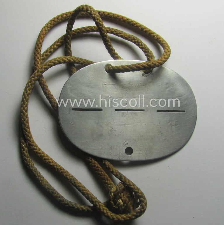 Aluminium-based, WH (Heeres) 'Heeres-Infanterie'- ie. 'GrossDeutschland-Division'-related ID-disc bearing the clearly stamped unit-designation that simply reads: '15. s.J.G.Kp.mot.-J.R.Gr. Dtschl.' and that comes mounted onto its period cord as worn