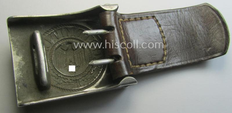 WH (Heeres) 'standard-pattern', field-grey-toned- and aluminium-based belt-buckle being a maker- (ie. 'Gebr. Gloerfeld'-) marked- and/or '1938'-dated example that comes mounted onto its leather-based tab