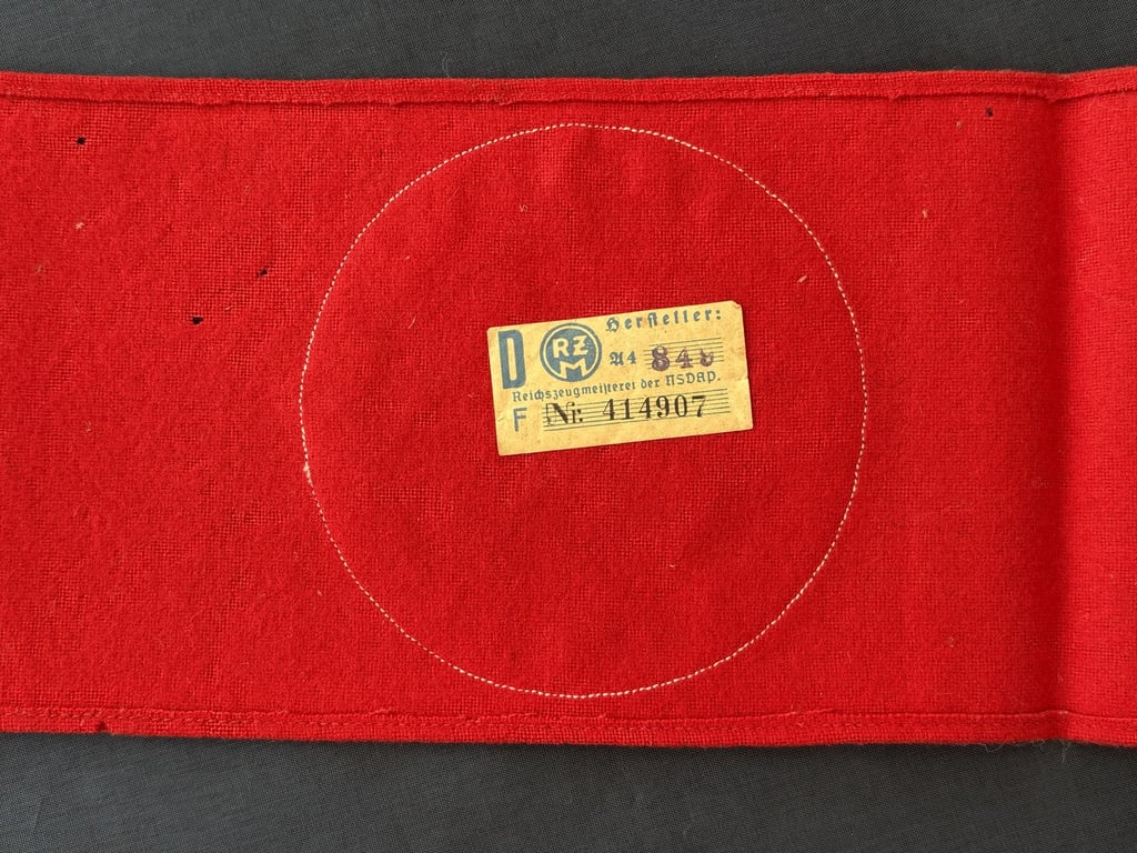 WWII GERMAN POLITICAL LEADERS’ THIRD REICH NAZI ARMBAND WITH RZM PAPER TAG.