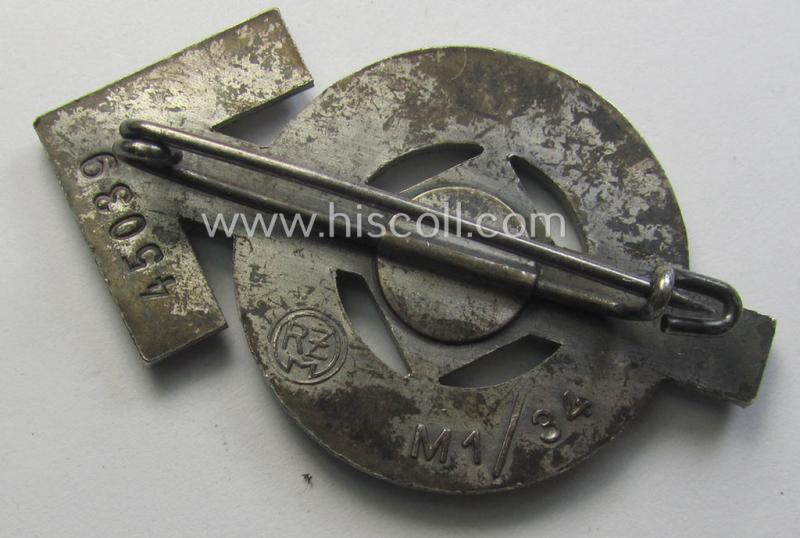 Attractive, HJ- (ie. 'Hitlerjugend'-) sports-badge (or: 'HJ-Leistungsrune') of the silver-class being a maker- (ie. 'RzM - M1/34'-) marked- and/or: 'Buntmetall'-based specimen that shows an engraved bearers'-numeral ('45039')