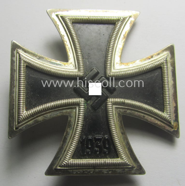 'Eisernes Kreuz 1. Kl.' (or: Iron Cross 1st class) being a typical maker- (ie. '15'-) marked (and non-magnetic!) example that as was produced by the Austrian maker (ie. 'Hersteller'): 'Friedrich Orth'
