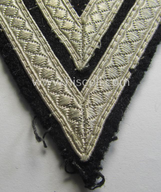 Neat - and just moderately used! - Waffen-SS- (ie. Heeres Panzer-) type 'Armwinkel' (or: rank-chevron) as executed on black-coloured wool as was intended for an: 'SS-Rottenführer' (ie. 'Obergefreiter')