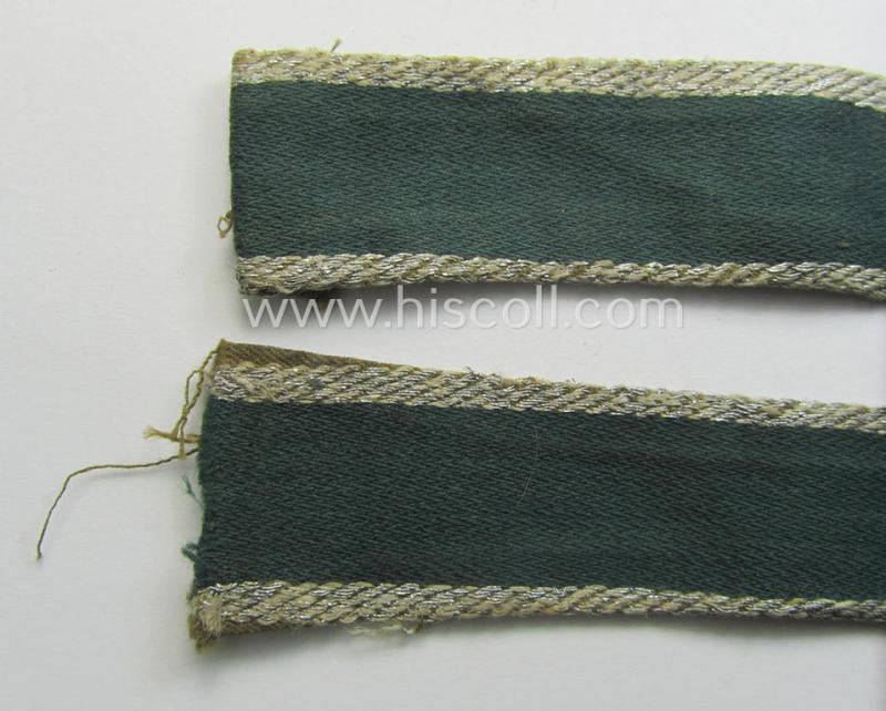 Truly worn, 'BeVo'-like cuff-title (ie. 'Ärmelstreifen') entitled: 'Afrikakorps' being a with certainty issued example that comes in an overall nice- (ie. somewhat shortened- and/or once tunic-attached-), condition