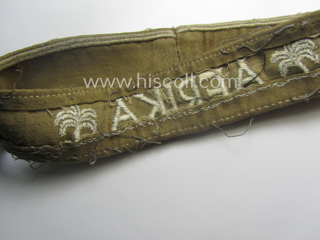 Cleary worn, WH cuff-title (ie. 'Ärmelstreifen') entitled: 'Afrika' (that bears a printed 'RbN.'-numeral!) being a minimally shortened example that comes in an overall very nice- (ie. issued and clearly worn ie. once tunic-attached-), condition