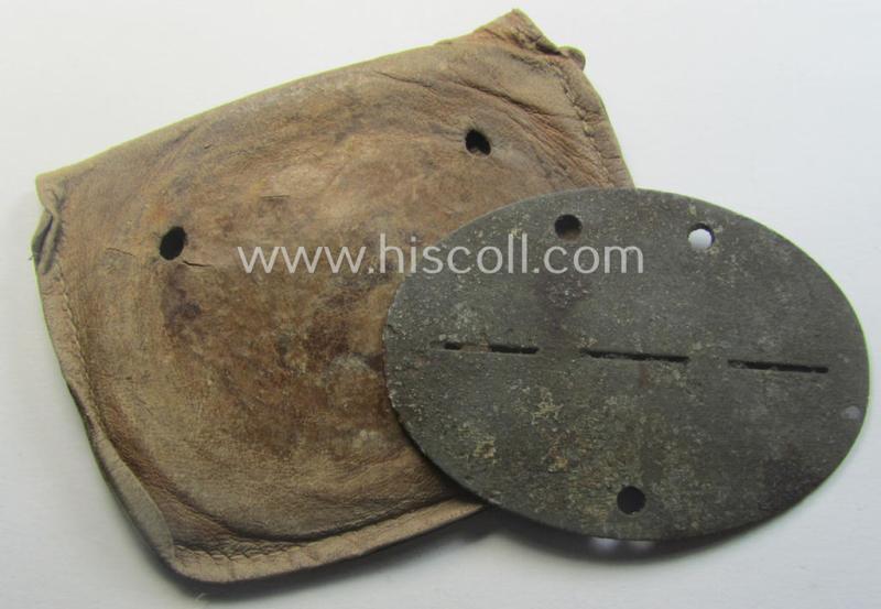 Zinc-based, WH (Heeres-) ie. 'Gebirgsjäger'-related ID-disc (ie. 'Erkennungsmarke') bearing the clearly stamped unit-designation that reads: '8./G.J.R. 137' and that comes stored in its leather-based pouch as issued and found