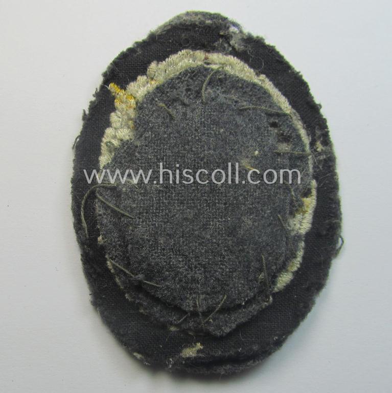 Truly worn WH (Luftwaffe) 'Fallschirmschützen-Abzeichen in Stoff' (or: cloth-based paratroopers' jump-badge) that is nicely machine-embroidered and being of the so-called: 'padded version'