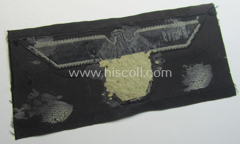 Later- (ie. mid-war-) period, WH (Heeres) 'Panzer'-type breast-eagle (ie. 'Brustadler für Panzertruppen') being a 'virtually mint- ie. unissued' example as executed in bluish-grey-coloured linnen on a black-coloured background