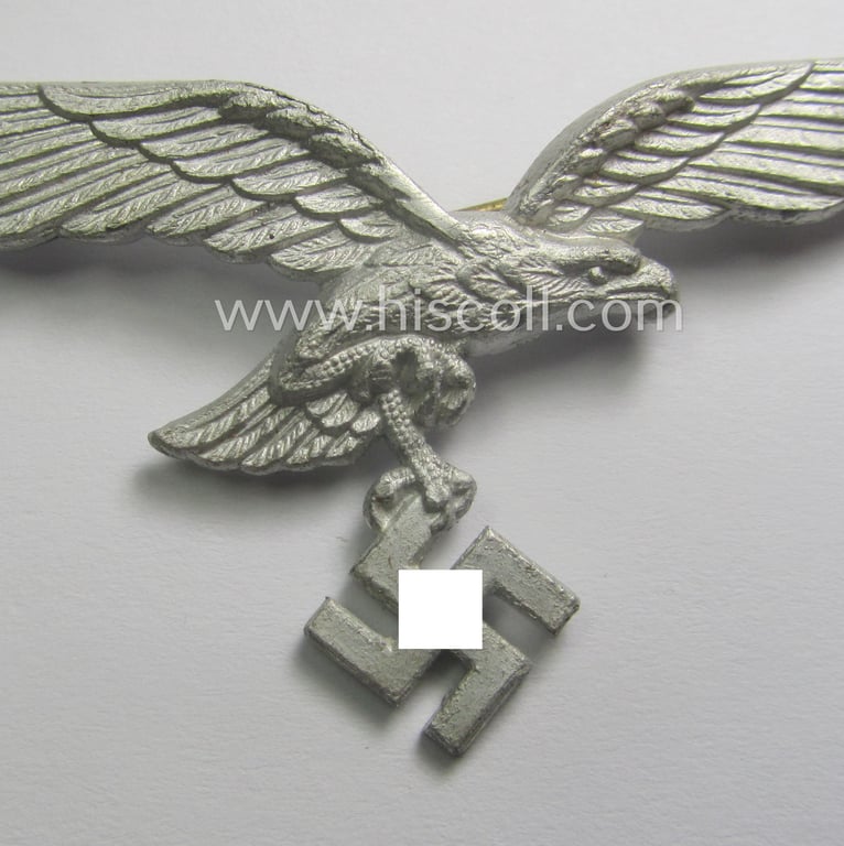 Minimally worn, WH (Luftwaffe) EM/NCO-pattern visor- (ie. 'Schirmmützen'-) cap-eagle being a maker- (ie. 'BSW'-) marked example as executed in aluminium based metal