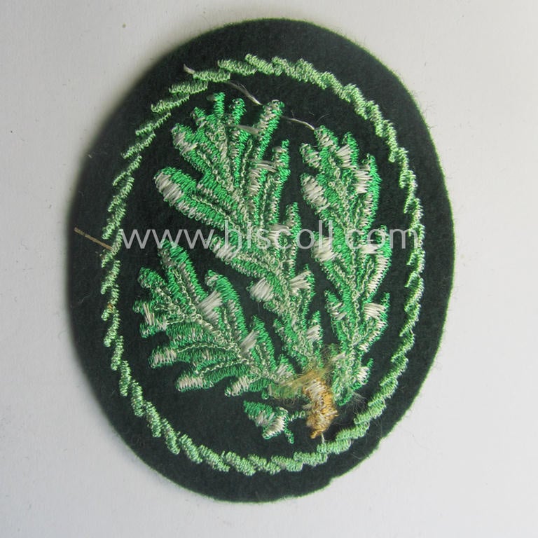 WH (Heeres) so-called: 'Jäger'-armbadge being a neatly machine-embroidered- and/or multi-coloured version as was executed on darker-green-coloured wool