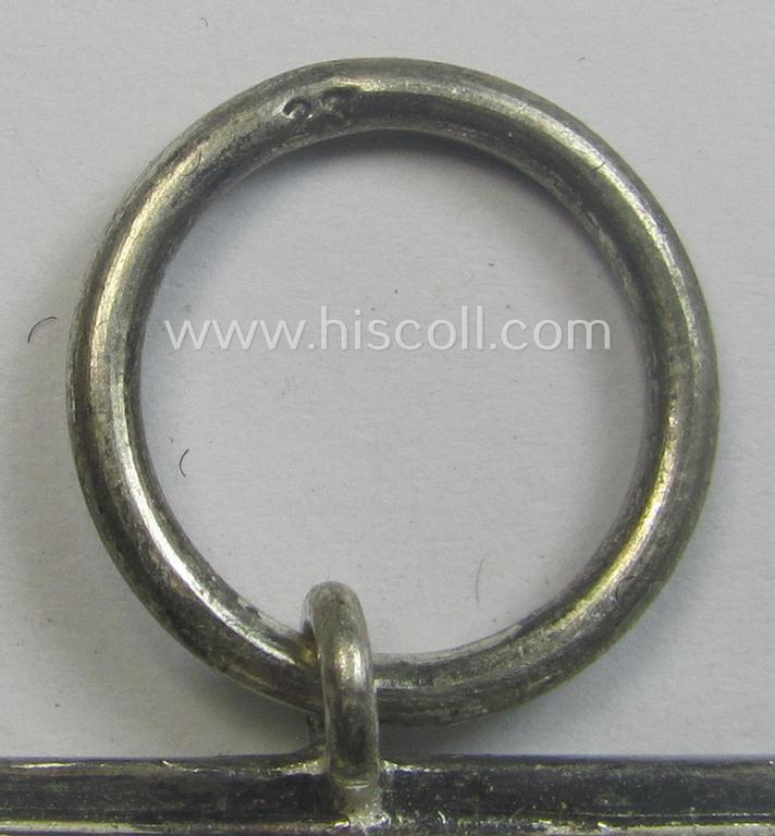 Iron Cross 2nd class (or: 'EK II. Klasse') being a maker- (ie. '23'-) marked example that comes together with its confectioned ribbon (ie. 'Bandabschnitt') as was produced by the maker (ie. 'Hersteller'): 'AG für Heeresbedarf….'