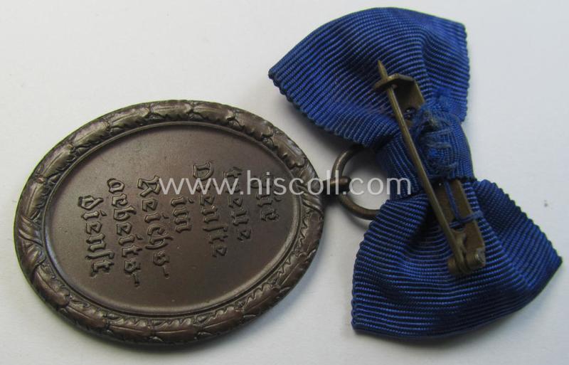 Superb example of a: 'Reichsarbeitsdienst der weiblichen Jugend' (or: RADwJ) so-called: 'Dienstauszeichnung 4. Stufe in Bronze' that comes mounted onto its period-attached ('bow-tie'-shaped!) ribbon (ie. 'Bandabschnitt')