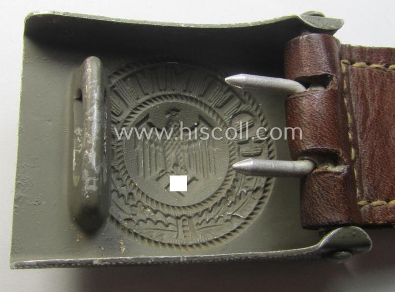 WH (Heeres) 'standard-issue'-pattern, field-grey-toned- and aluminium-based belt-buckle being a maker- (ie. 'G. Brehmer'-) marked- and/or: '1938'-dated example onto its leather-based tab
