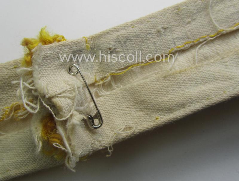 WH cuff-title (ie. 'Ärmelstreifen') entitled: 'Kreta' (being an example that bears a printed 'RbN.'-numeral and that comes in an issued-, clearly worn- and/or most certainly once tunic-attached, condition)