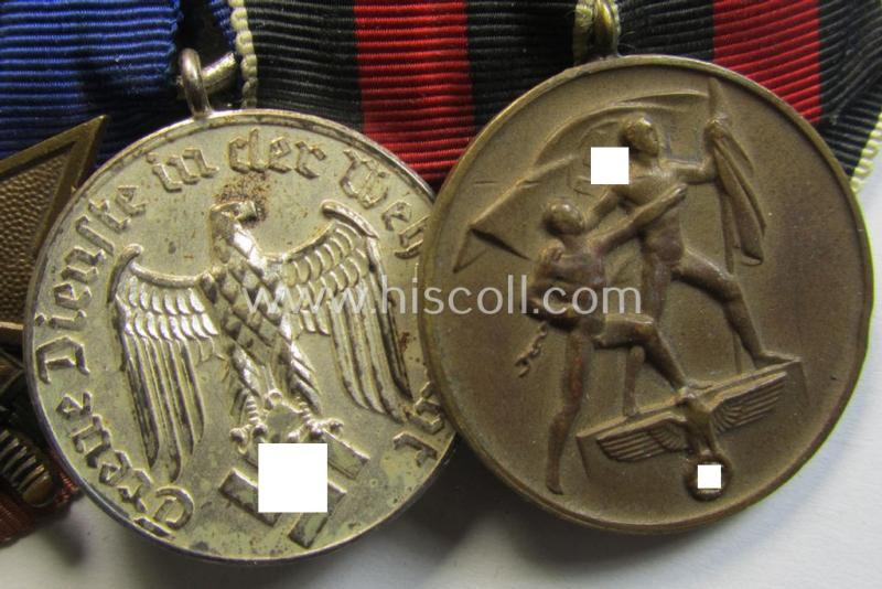 Three-pieced medal-bar (ie. 'Ordenspange') respectively depicting a: 'KvK II. Klasse m. Schw.', a: WH (Heeres o. KM) so-called: 'Dienstauszeichnung für 4 Jahre Treue Dienste' and a: Czech 'Anschluss'-medal: '1 Oktober 1938'