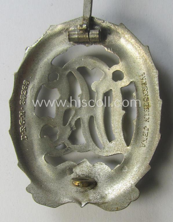 'Reichssportabzeichen DRL in Silber' (or: DRL sports'-badge in silver) being a just moderately worn- ie. used example that is nicely maker- (ie. 'Wernstein - Jena'-) marked on its back