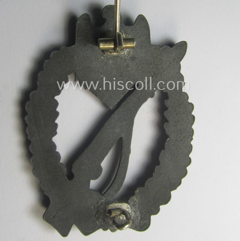 'Infanterie Sturmabzeichen in Silber' (or: silber-class infantry assault-badge ie. IAB) being a non-maker-marked, zinc- (ie. 'Feinzink'-) based example as was (I deem) produced by the: 'S.H.u.C.o.'-company